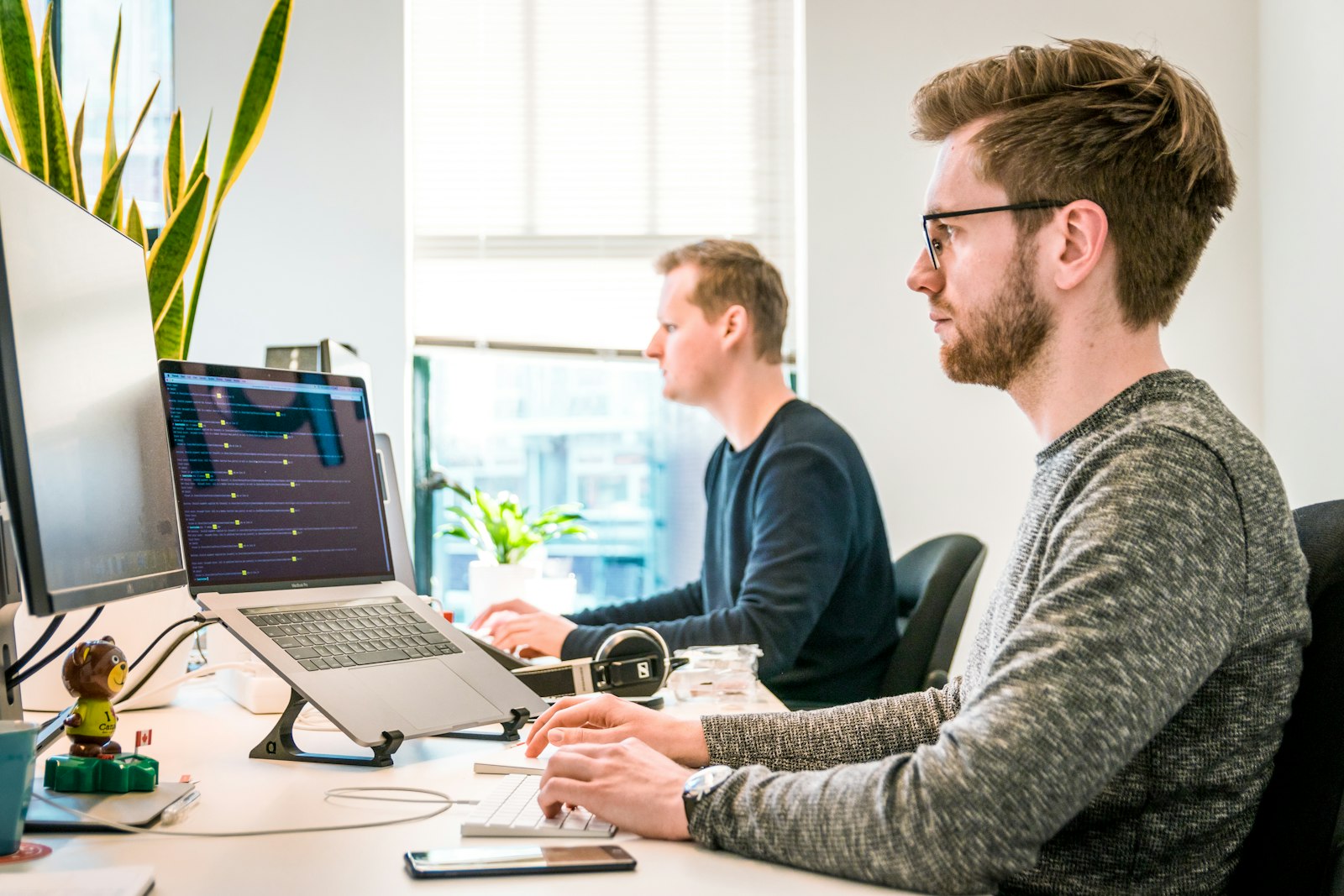 Colleagues working together at computers