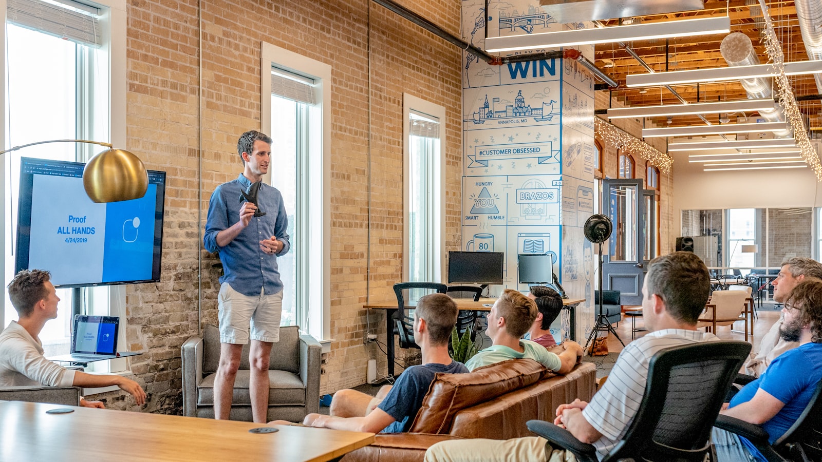 A founder presenting to a small team